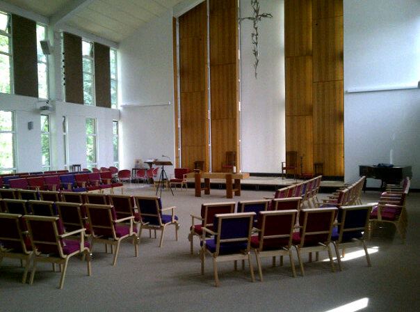Image of inside of Brookside showing chairs and communion table